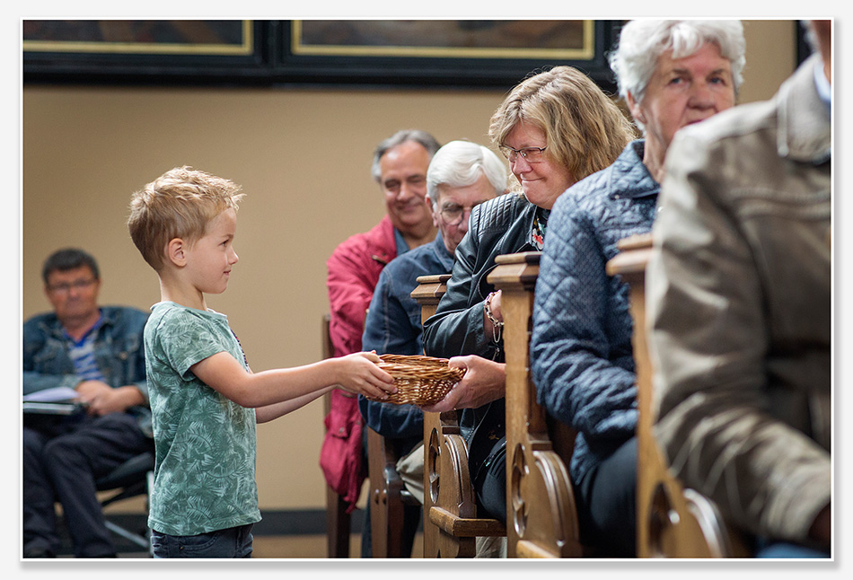 Een glimlach tijdens de afscheidsdienst