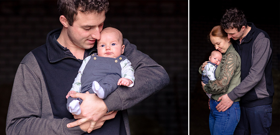 Man houdt liefdevoll zijn vrouw en zijn pasgeboren baby vast